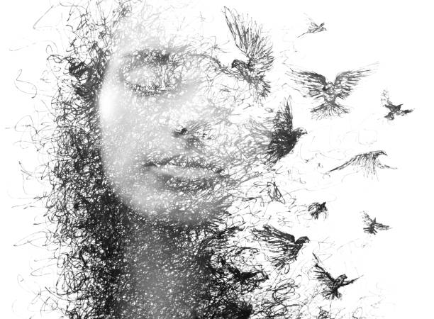 Paintography. Double Exposure portrait of an elegant woman with closed eyes combined with hand made pencil drawing of a flock of birds flying freely resembling disintegrating particles of her being, black and white stock photo