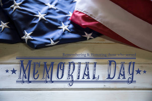 Memorial Day American Flag on White wooden Table This is a close up photo of an American flag on and old retro white wooden table. This is a great image for memorial day, Fourth of July, veterans Day, etc. us memorial day photos stock pictures, royalty-free photos & images