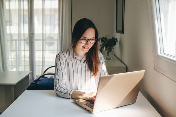 istock Girl working using laptop in home office 1149127181
