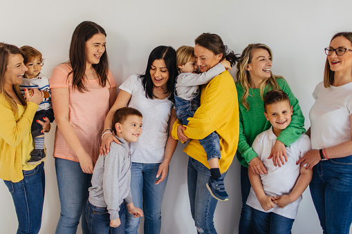 Portrait of sisters and their kids in photo studio