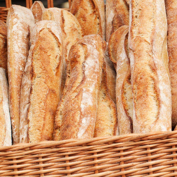 istock fresh wheat baguettes in a wicker basket 1149129372