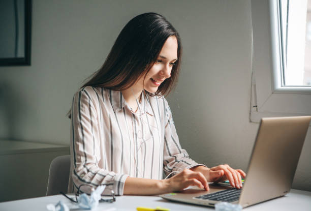 istock The girl uses a laptop. 1149129417