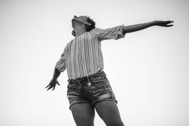 istock Woman spreading hands with joy 1149130239