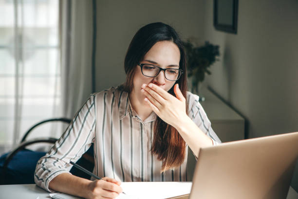 istock Young beautiful girl is yawning. 1149131439