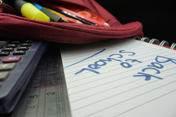 istock School supplies on blackboard background ready for your design 1149132777