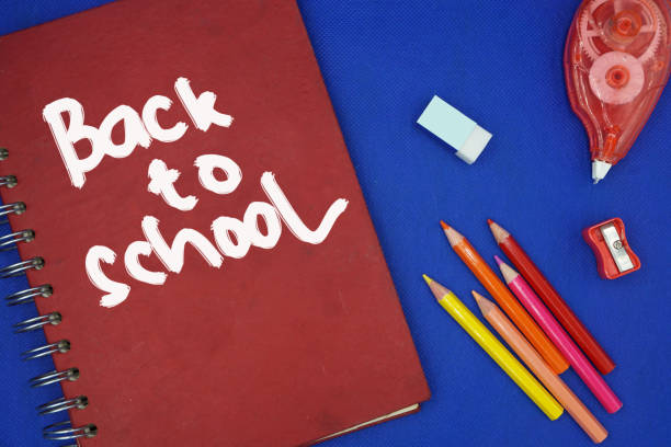 istock School supplies on blackboard background ready for your design 1149133107