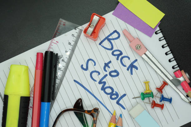 istock School supplies on blackboard background ready for your design 1149135200