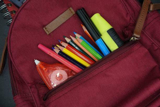 istock School supplies on blackboard background ready for your design 1149136641