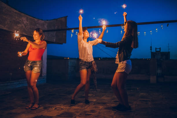 istock Rooftop party with sparkler 1149139503