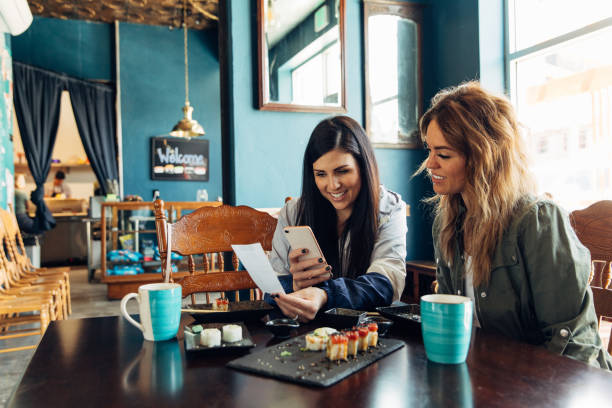 istock Woman Tracking Restaurant Bill 1149141443