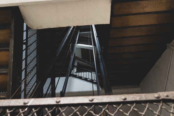 istock Vertigo stairs without light on the end 1149144187