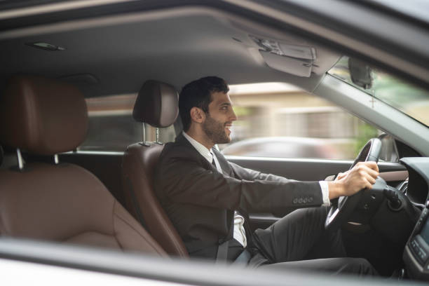 istock Businessman commuting to work, driving car 1149151894
