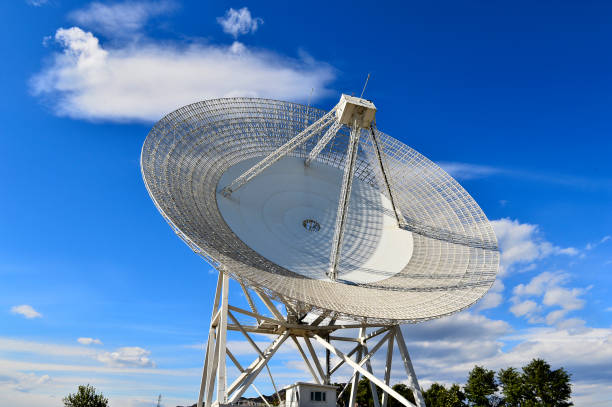 istock Array of satellite dishes or radio antennas against sky. Space o 1149153522