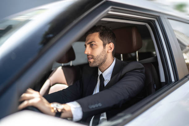 istock Worried businessman commuting to work, driving car 1149153757