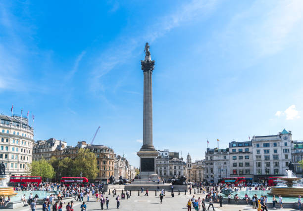 Busy Trafalgar Square London UK on sunny London - England, Trafalgar Square, Nelson's Column, City Of Westminster - London, City of London admiral nelson stock pictures, royalty-free photos & images