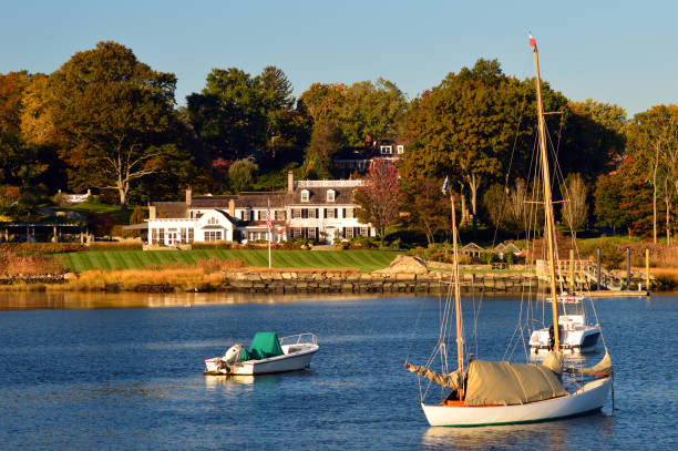 Waterfront estate, Greenwich, Connecticut Greenwich, CT, USA October 27, 2013 Sailboats are moored in Indian Harbor in front of an estate in Greenwich Connecticut connecticut stock pictures, royalty-free photos & images
