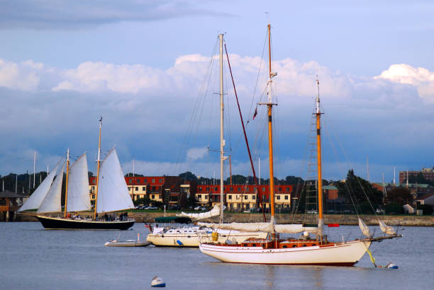 Newport, RI, USA September 15, 2008 Sailboats and schooners full of people crowd the harbor in Newport, Rhode Island