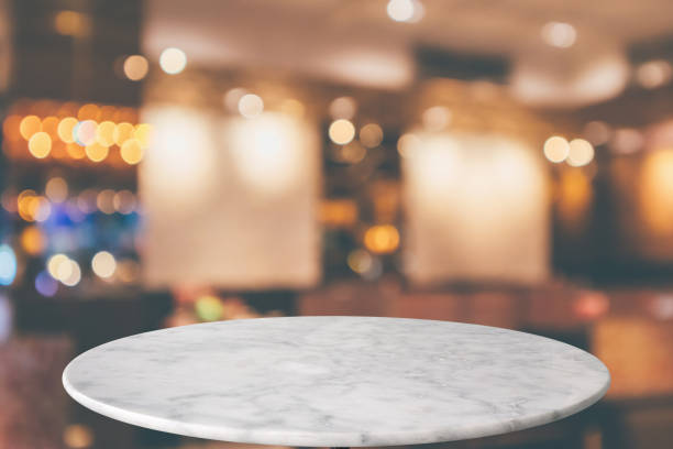 istock round marble table top with cafe restaurant bokeh lights abstract background for montage product display 1149157447