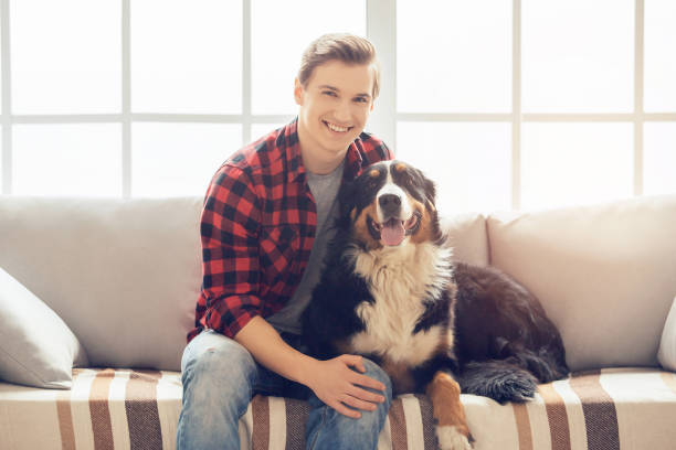 istock Young person with dog at home leisure 1149157514