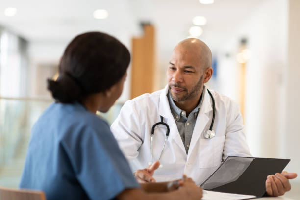 istock Medical team discusses patient's course of treatment 1149157656