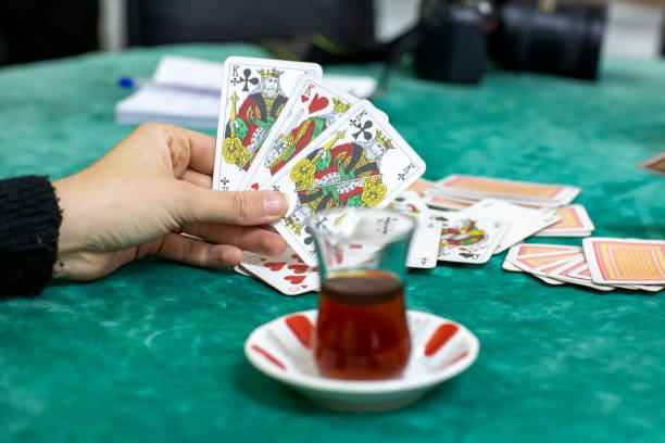 istock Young couple playing playing card game, cards. 1149158996