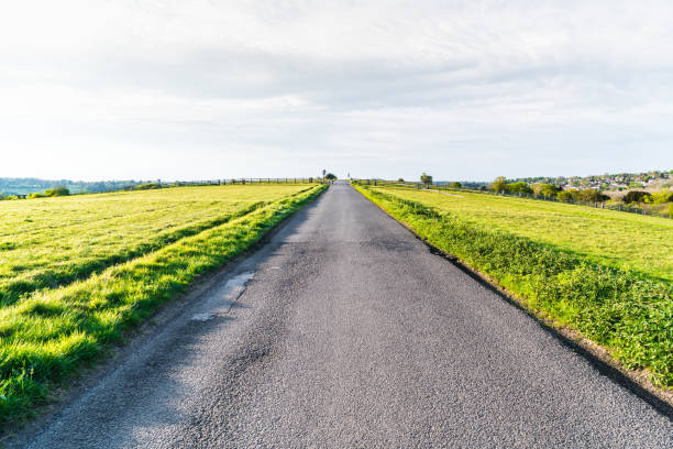 istock Sunny country road 1149159073