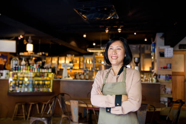 istock Senior Cafe owner standing with crossed arms 1149170112