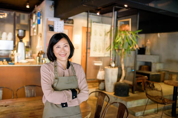 istock Senior Cafe owner standing with crossed arms 1149170463