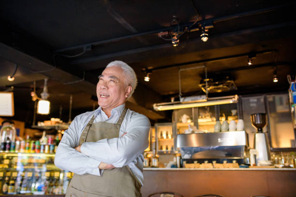 istock Senior Cafe owner standing with crossed arms 1149170617