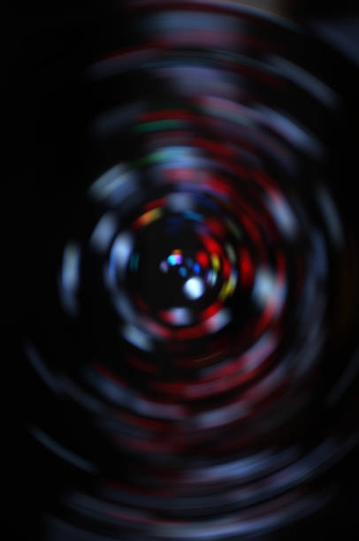 istock Blurred LED screen closeup. Glowing threads in a color spectrum on a black background. 1149174519