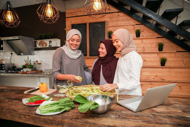 istock Malay Muslim Mother and Her Daughters Cooking in the Kitchen 1149175976