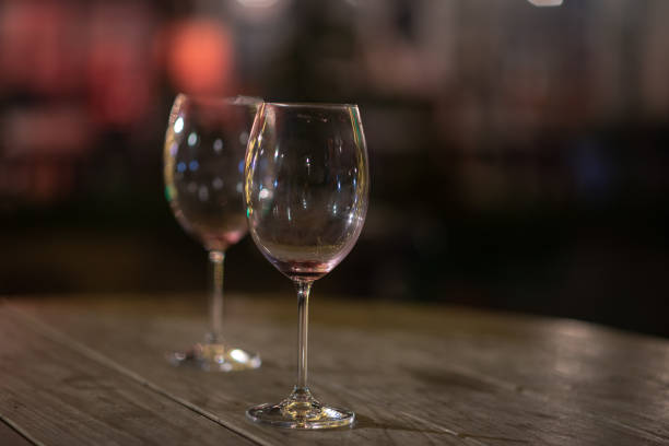 Close up shot of two empty wine glasses on table