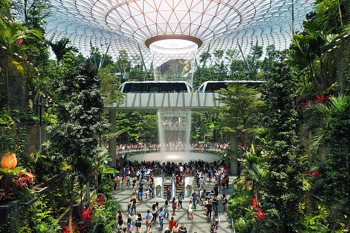SINGAPORE - 12 MAY 2019: The Rain Vortex, a 40m-tall indoor waterfall located inside the Jewal Changi Airport in Singapore