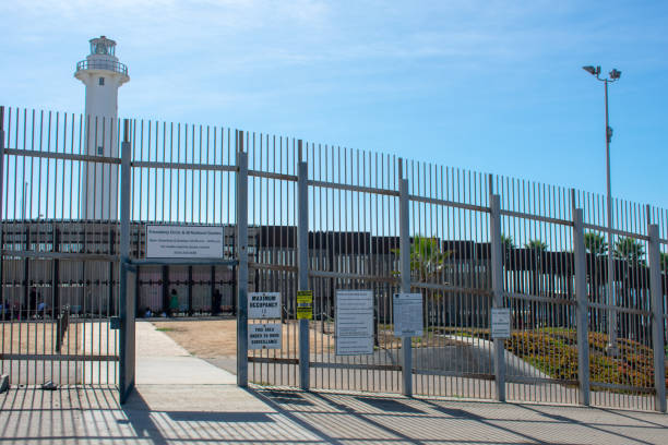 Separated migrant family members reunite with relatives through border wall San Diego, California, USA - November 3, 2018 : Separated migrant family members reunite with relatives through border wall on United States - Mexico international border at Friendship Park exclusion group of people separation fish out of water stock pictures, royalty-free photos & images