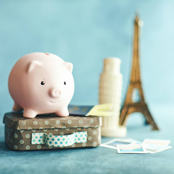 Little pink piggy bank on vacation. Saving for European Vacation Little pink piggy bank on vacation. Conceptual image to portray saving for a vacation to Europe. pisa leaning tower of pisa tower famous place stock pictures, royalty-free photos & images