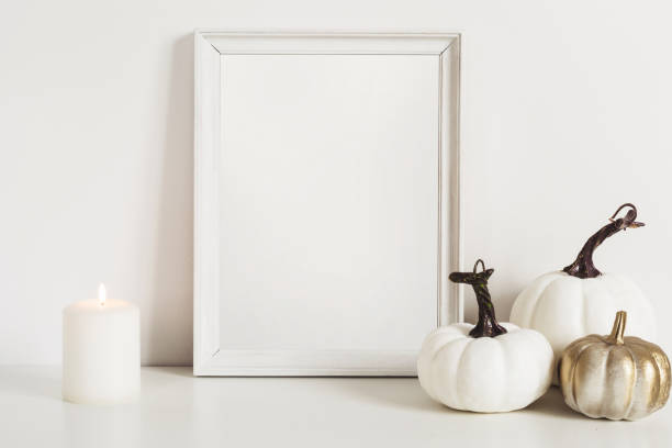 istock Photo frame and white pumpkins. Mockup Copy space for artwork. Autumn decor in interior 1149178279