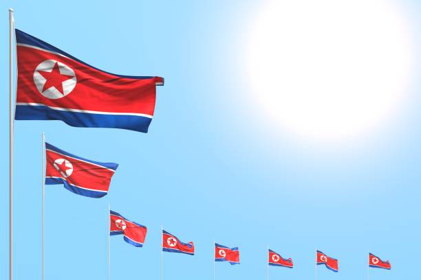 istock cute anthem day flag 3d illustration
 - many North Korea flags placed diagonal on blue sky with space for your text 1149179231