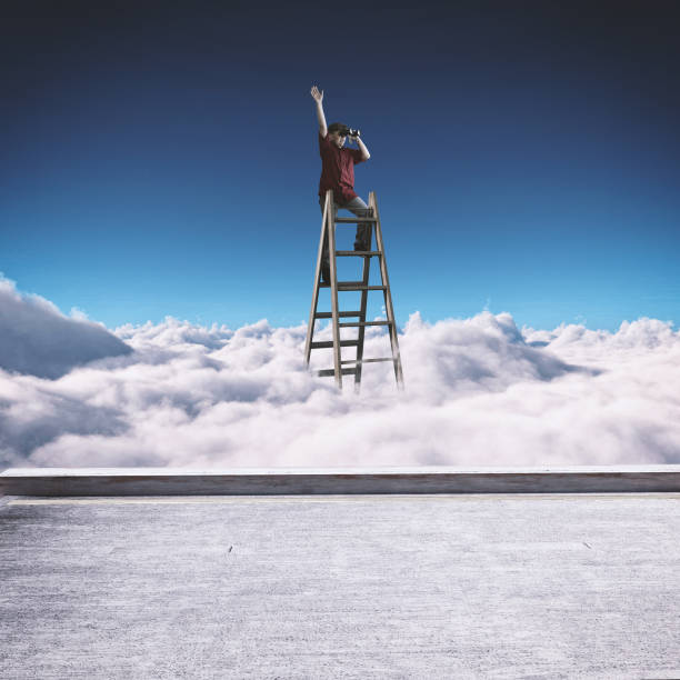 istock Young man on top of a ladder overclouds looking through binoculars. 1149179256