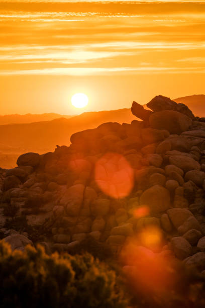 Sunrise over Yucca Valley, with view east to Joshua Tree National Park mountain range.