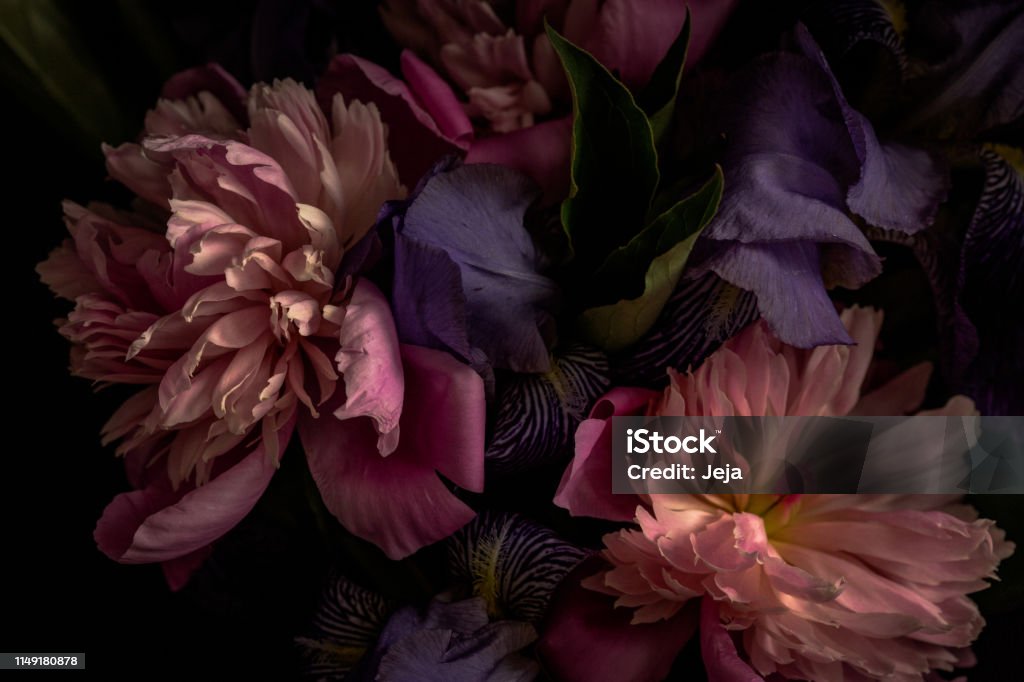 Dark-toned photo of bouquet Dark-toned photo of lilies and peonies in vase. Flower Stock Photo