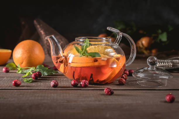 istock Glass teapot with herbal tea, orange and mint 1149182731