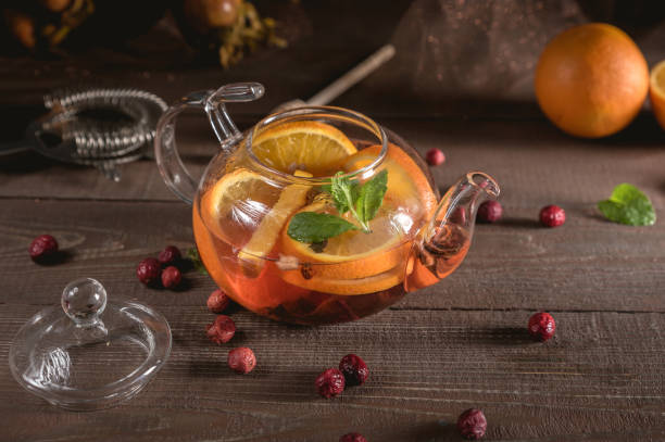 istock Glass teapot with herbal tea, orange and mint 1149182732