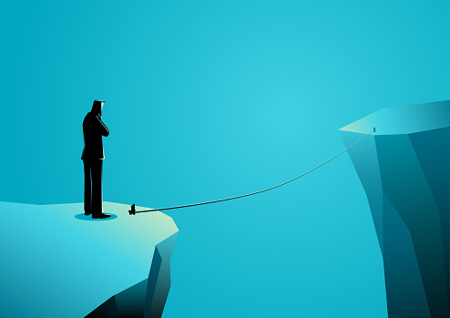 Business concept vector illustration of a businessman standing on the edge of ravine thinking or doubting before making a decision to cross using thin rope.
