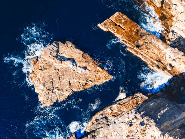 istock Shapely rocks in the ocean aerial views 1149186425