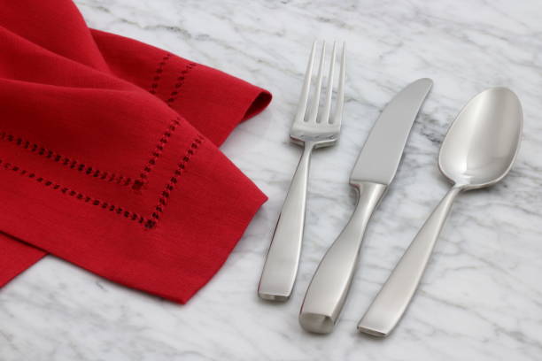 istock silverware and hemstitch napkin on antique carrara marble 1149187524