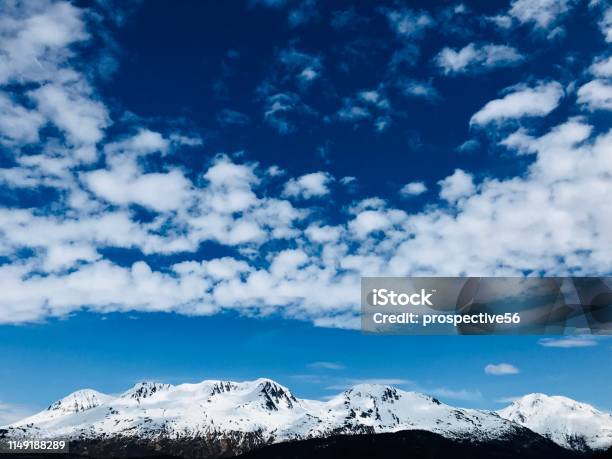 Beautiful Cloudscape And Snowy Mountain Ridges In Front Of Exit Glacier Area At Kenai Fjords National Park In Seward Alaska Usa Stock Photo - Download Image Now