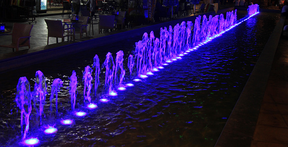 Night colorful lighted fountain in center of Antalya, Turkey