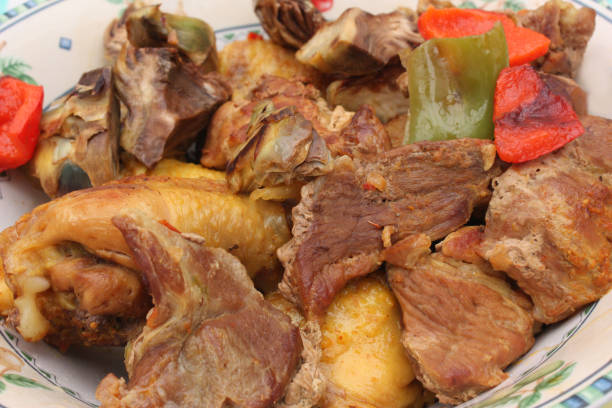 istock Preparing a stew with chicken and pork 1149191355