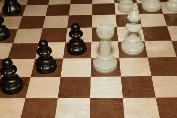 istock Wooden chess board and white pawns for skill theme 1149191907