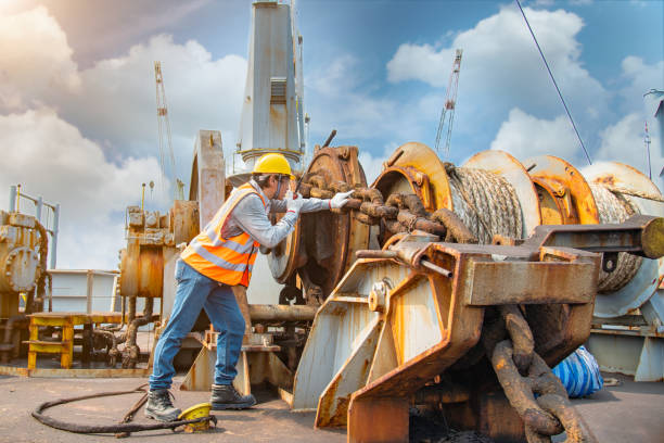 Status in work engineering or worker, motor man, loading master or controller working in communication by walkie talkie to team for safety loading winch of the crane, lifting gear operation in industrial at work wire rope stock pictures, royalty-free photos & images